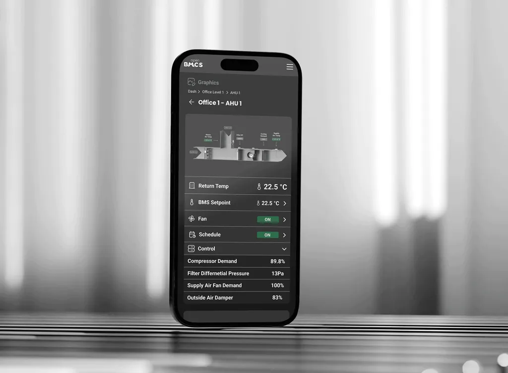 An iPhone displaying an AHU (Air Handling Unit) page from the OpenBMCS BMS User Interface, featuring interactive controls and detailed mechanical information.